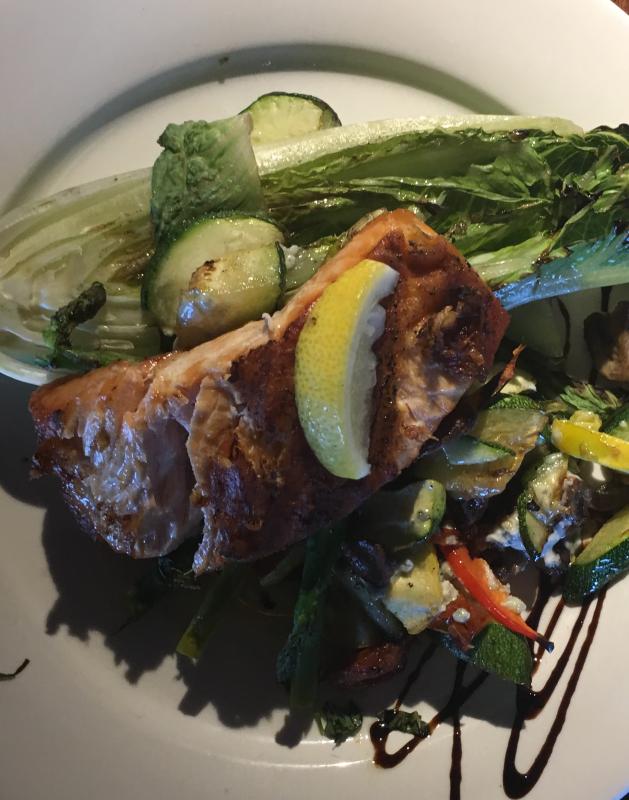 Roasted salmon on grilled romaine lettuce. Mine Oyster Restaurant. Ralph Smith photo