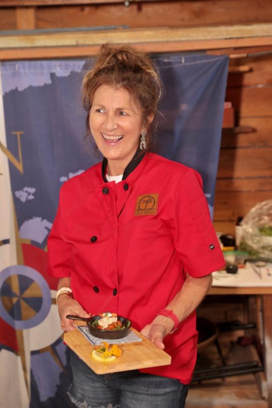 Chef Lori Mitchell with her winning bite: V-Notched Pretzel Bite -An egg-baring V-Notched, soft Pretzel smothered in garlic & lemon butter, stuffed with Maine’s best lobster meat sautéed in supreme cream sauce. Finished with sea salt, sprig of dill, chive blossom, lemon zest & roe. Claw Down 2024