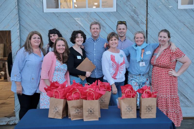 Members of the Board and staff of the Boothbay Harbor Region Chamber of commerce gather for a photo at the Shipyard in Boothbay Harbor. Boothbay Harbor Region Chamber of Commerce Claw Down 2024