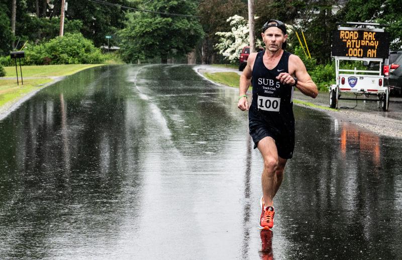 Perry Lebreton of Milford crosses the finish line to win the 10K leg of the Edgecomb 250th Birthday Road Race on June 22. Lebroton timed his run at 37 minutes, 22 seconds. Bisi Cameron Yee photo