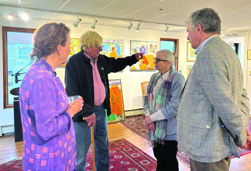 Rusty Court, gesturing, talking about Monhegan Island with Christie Eisner McDonald, to his right. LISA KRISTOFF/Boothbay Register