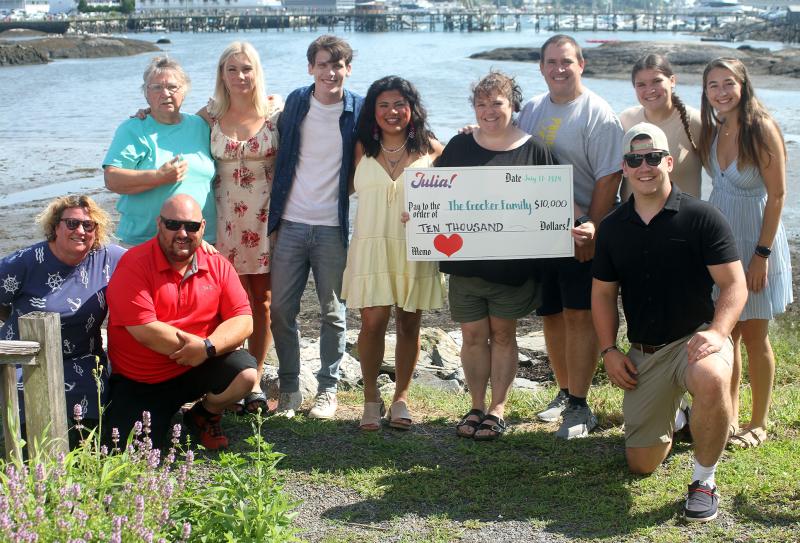 Julia Gagnon with members of the Crocker family at the benefit show at Brady’s restaurant on July 17. STEVE EDWARDS/Boothbay Register