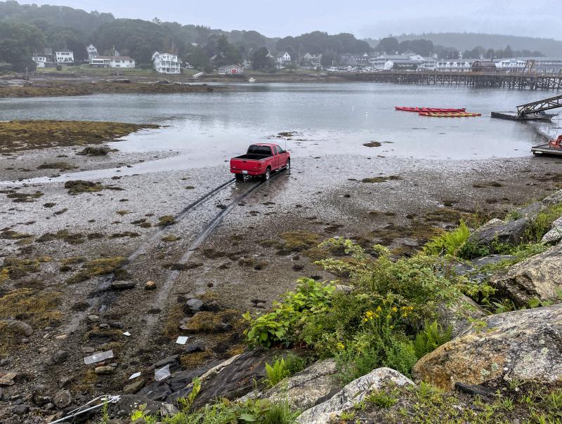 A truck ended up in the inner Boothbay Harbor in what appeared to be an accident Monday. FRITZ FREUDENBERGER/Boothbay Register