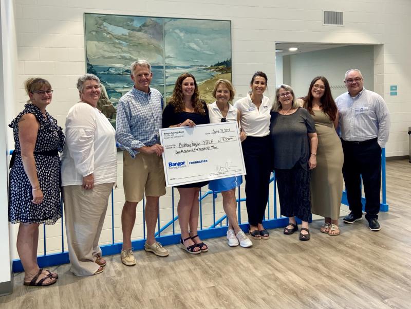 Pictured from left are: Samantha Footer, Bangor Savings Bank Boothbay Relationship Manager; Julie Shepard, Bangor Savings Bank Wealth Management; Andy Hamblett, Boothbay Region YMCA CEO; Tracy Warlick, Boothbay Branch Manager; Gena Canning, Bangor Savings Bank Board Chair; Mariah Lussier, Bangor Savings Bank payroll; Allyson Goodwin, Boothbay Region YMCA’s Director of Development; Brynne Whitney, Damariscotta Manager, and Kelly Winslow, Mid Coast Regional Manager for Bangor Savings Bank. Courtesy photo