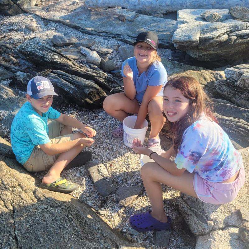 From left, Harland Johnson, Briar Johnson and Adeline Boucher on the shore. Courtesy of Jennifer Lassen