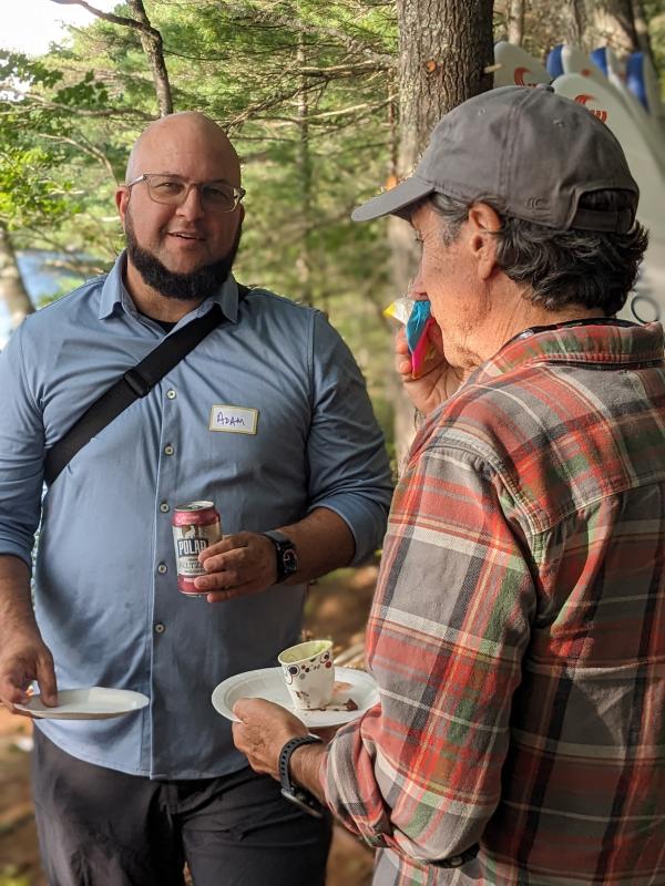 Adam Burk of Peter Alfond Foundation, left, attends the dedication. CANDI JONETH/Boothbay Register Two men