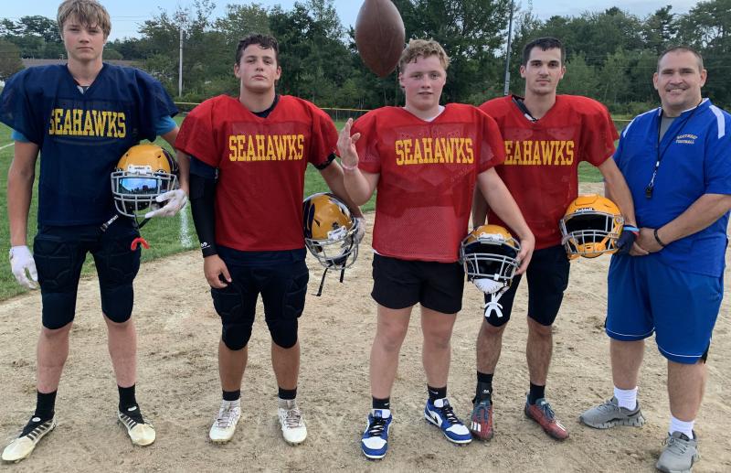 The Boothbay Seahawks open their 2024 season Sept. 5 with a road contest versus defending division champion Old Orchard Beach. Pictured, senior captains, from left, Spencer Wenners, Maddox Cusumano, Tyson French and Aidric Canada and coach Ed Crocker. BILL PEARSON/Boothbay Register