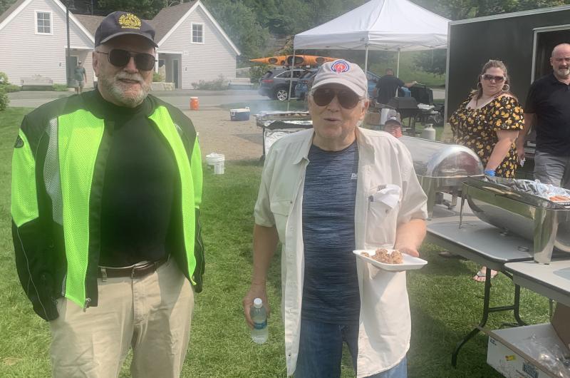 The V.E.T.S. Inc. barbecue fundraiser Aug. 17 drew a big crowd including Joe Grant, left, and Steve Carbone. BILL PEARSON/Boothbay Register