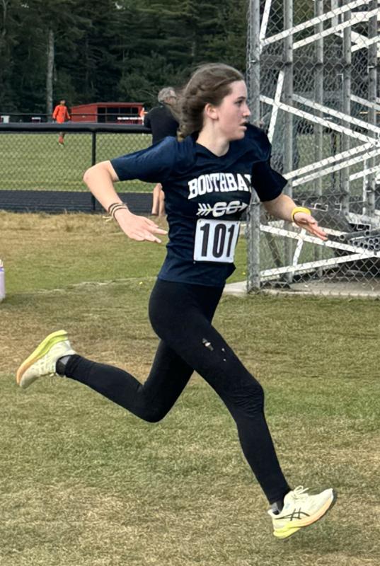 Stella Koller sprints toward the finish line. Courtesy of Barbara Crocker A girl runner