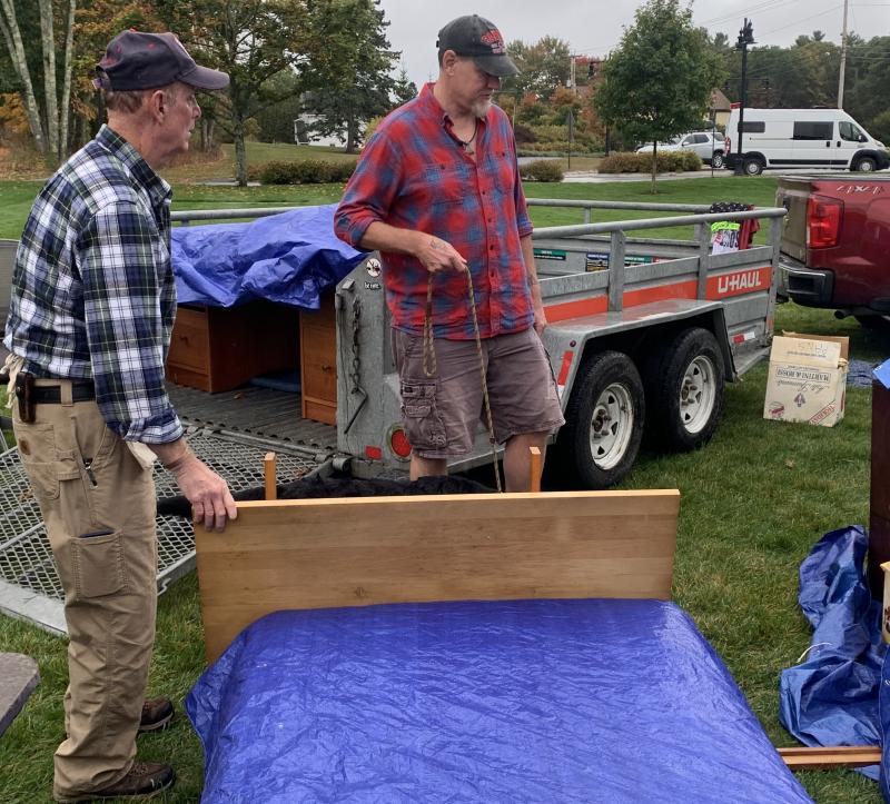 Volunteer Chris Goodwin dickers with a customer Oct. 5 during the American Legion yard sale. BILL PEARSON/Boothbay Register Chris salesman