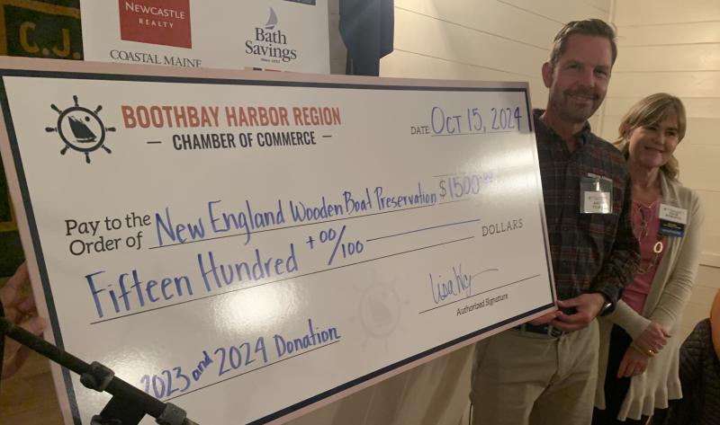 Bristol Marine Founder and Co-owner Andy Tyska and Chamber President Julie Roberts presents a $1,500 donation to the New England Wooden Boat Preservation Fund during the ceremony. BILL PEARSON/Boothbay Register big check