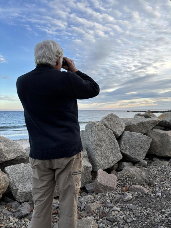 Jeff scanning shorebirds at Fortune's Rocks in Biddeford. A cave swallow had been seen nearby earlier that day, but the authors didn't know it at the time. Courtesy of Allison Wells Jeff scanning shorebirds at Fortune's Rocks in Biddeford. A cave swallow had been seen nearby earlier that day, but the authors didn't know it at the time. Courtesy of Allison Wells