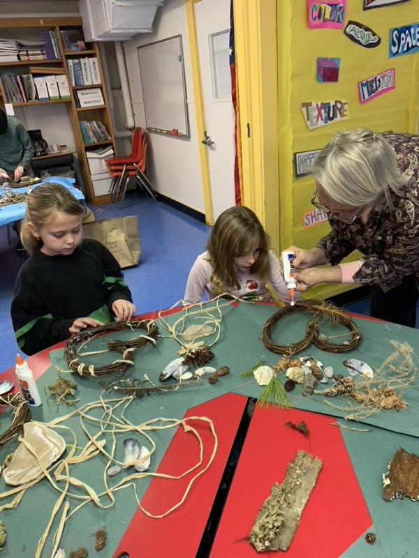 Wreath-making instructor Elizabeth Stover helps with the process. Courtesy of Eileen Higgins Mrs. Stover