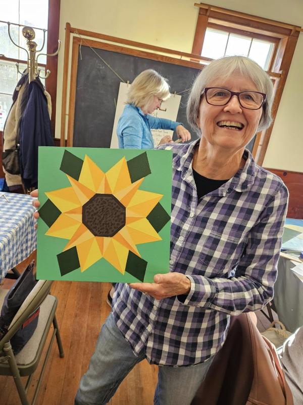 Rita Arnold and her sunflower. Courtesy of Saskia Reinholt Facebook page Rita Arnold and her sunflower. Courtesy of Saskia Reinholt