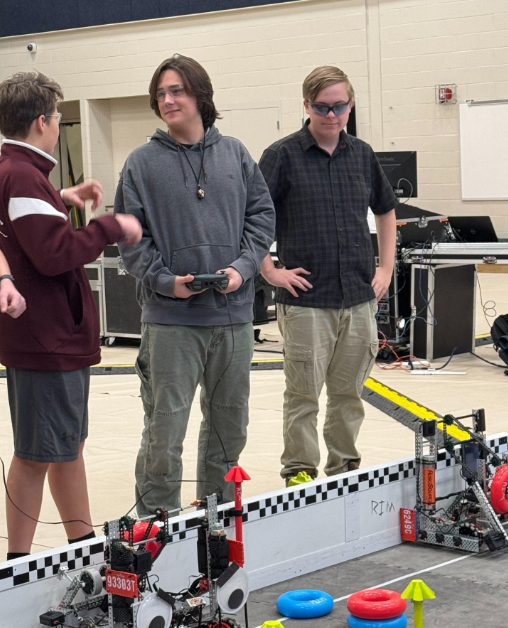 Silas Lehouillier and Afton Warren-Burdin discuss strategy with an alliance partner before beginning a match. Courtesy photo Silas Lehouillier and Afton Warren-Burdin discuss strategy with an alliance partner before beginning a match. Courtesy photo