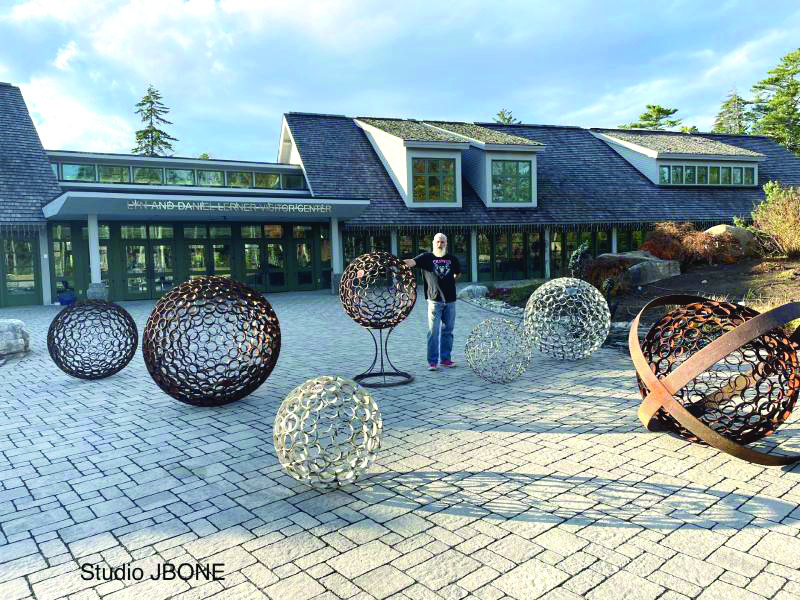 Jay "JBONE" Sawyer of Warren and a few of his spheres in his "Spiritual Influence" installation at CMBG. Jay "JBONE" Sawyer of Warren and a few of his spheres in his "Spiritual Influence" installation at CMBG.