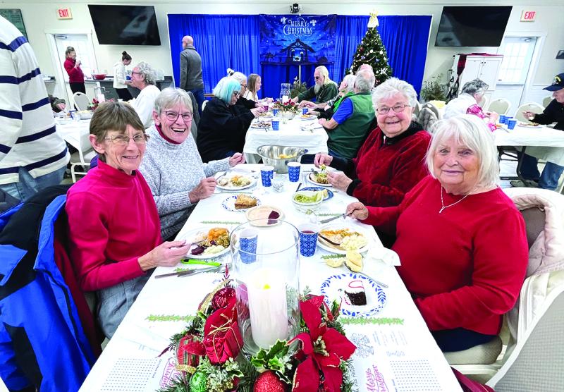 Happy diners at the Christmas dinner. Courtesy of Barb House Christmas dinner at Legion Hall