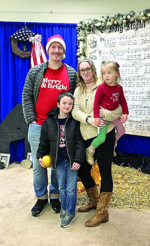 A family at the Christmas dinner. Courtesy of Barb House Christmas dinner at Legion Hall