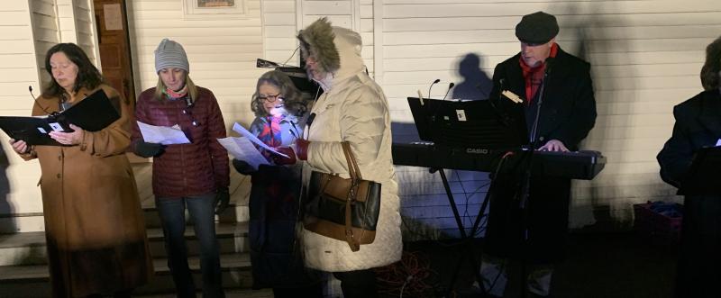 Audience members joined in the Christmas carols Dec. 7 at Our Lady Queen of Peace's live nativity scene. BILL PEARSON/Boothbay Register chorus