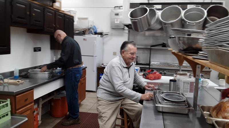 Harry Grindall, left, and Art Richardson work on meal prep the day before Thanksgiving. JANE CARPENTER/Boothbay Register Wednesday in the kitchen