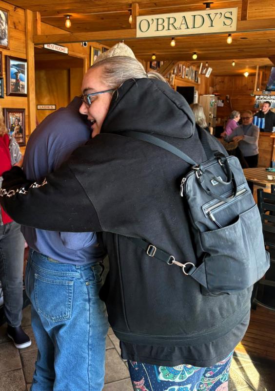 Kristen Campbell gets a hug at the Feb. 17 community lunch. Courtesy of Matt Longfellow Kristen Campbell gets a hug at the Feb. 17 community lunch. Courtesy of Matt Longfellow