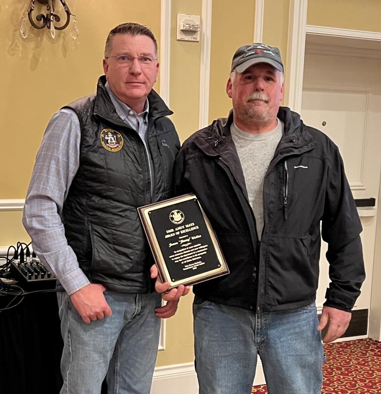 In 2023, Maine Department of Marine Resources Commissioner Patrick Keliher (left) presents the annual DMR Andy Mays Award of Excellence to Friendship fisherman James "Jimmy" Wotton, of Friendship. The award was presented at the Fishermen's Forum in Rockport. (Photo courtesy Department of Marine Resources) Keliher