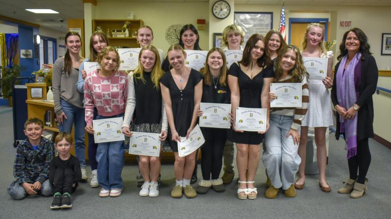 The Boothbay Region High School cheerleading team. Top row, from left to right: coach Madeleine McLellan, Maya Jacobs, Bailey Lewis, Skyla Carrier, Titan Lewis, Izzy Andreasen, Brianna Campbell and coach Michele Barter. Bottom row: Ariyah Green, Olivia Ritall, Maddie Andreasen, Abigail Babineau, Gabby Crowell and Sarah Harris. Also pictured are Brody Campbell and Gabe Andreasen. FRITZ FREUDENBERGER/Boothbay Register. The Boothbay Region High School cheerleading team. Top row, from left to right: coach Madeleine McLellan, Maya Jacobs, Bailey Lewis, Skyla Carrier, Titan Lewis, Izzy Andreason, Brianna Campbell and coach Michele Barter. Bottom row: fans Brody Campbell and Gabe Andreason, Ariyah Green, Olivia Ritall, Maddie Andreason, Abigail Babineau, Gabby Crowell and Sarah Harris. FRITZ FREUDENBERGER/Boothbay Register.