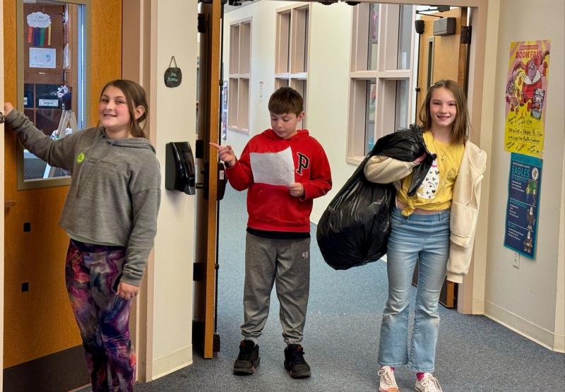 EES students knock on the door of Pre-K teacher, Sally Monroe, to collect paper for recycling. Briar, daughter of Arianna and Brice Johnson; Bryson, son of Melissa and Joseph Hersom; and Azalea, daughter of Laurel and Max Averill. Students are residents of Alna and Edgecomb. Courtesy photo EES students knock on the door of Pre-K teacher, Sally Monroe, to collect paper for recycling. Briar, daughter of Arianna and Brice Johnson; Bryson, son of Melissa and Joseph Hersom; and Azalea, daughter of Laurel and Max Averill. Students are residents of Alna and Edgecomb. Courtesy photo