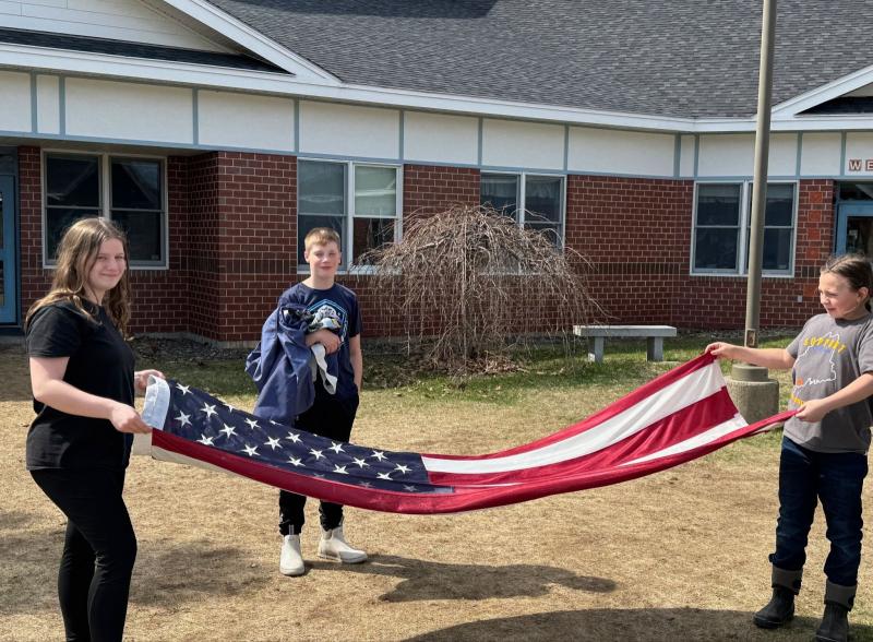 Edgecomb Eagles folding the flag are Isabel, daughter of Cashel and Brian Fanslau; Mason, son of Nicole McKay and Patrick Wenners; and Andrew, son of Amanda and Andy Main. Students are residents of Alna and Edgecomb. Courtesy photo Edgecomb Eagles folding the flag are Isabel, daughter of Cashel and Brian Fanslau; Mason, son of Nicole McKay and Patrick Wenners; and Andrew, son of Amanda and Andy Main. Students are residents of Alna and Edgecomb. Courtesy photo