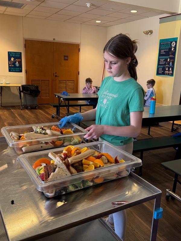 Lilianna, daughter of Trista and Brian Cassidy, collects leftovers to be taken to the compost area next to the EES gardens. Courtesy photo Lilianna, daughter of Trista and Brian Cassidy, collects leftovers to be taken to the compost area next to the EES gardens. Courtesy photo