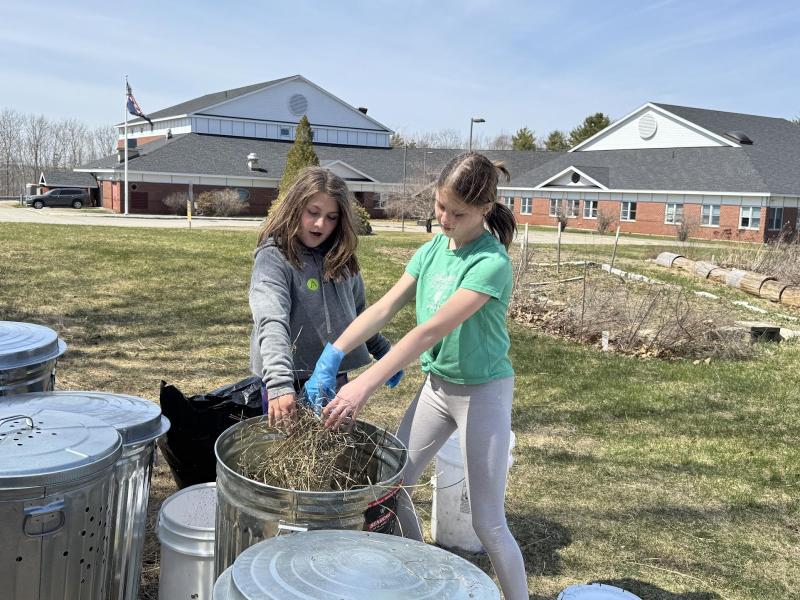 Sixth grade helpers Briar, daughter of Arianna and Brice Johnson, and Lilianna, daughter of Trista and Brian Cassidy, sprinkle hay between layers of compost in one of eight 31-gallon bins, donated by Ames True Value of Wiscasset and an EES teacher. Students are residents of Alna and Edgecomb. Courtesy photo Sixth grade helpers Briar, daughter of Arianna and Brice Johnson, and Lilianna, daughter of Trista and Brian Cassidy, sprinkle hay between layers of compost in one of eight 31-gallon bins, donated by Ames True Value of Wiscasset and an EES teacher. Students are residents of Alna and Edgecomb. Courtesy photo