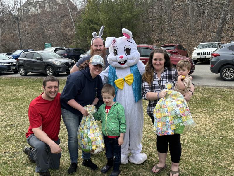 Golden Egg finders received age-appropriate Easter baskets at the April 19 EGGstravaganza. From left, Chad Murray and Caitlin Murphy with son Oliver Murray, age 5 and 51 weeks; Easter Bunny, Hannah Prest and son Hudson Martin, 17 months. LISA KRISTOFF/Boothbay Register LISA KRISTOFF/Boothbay Register