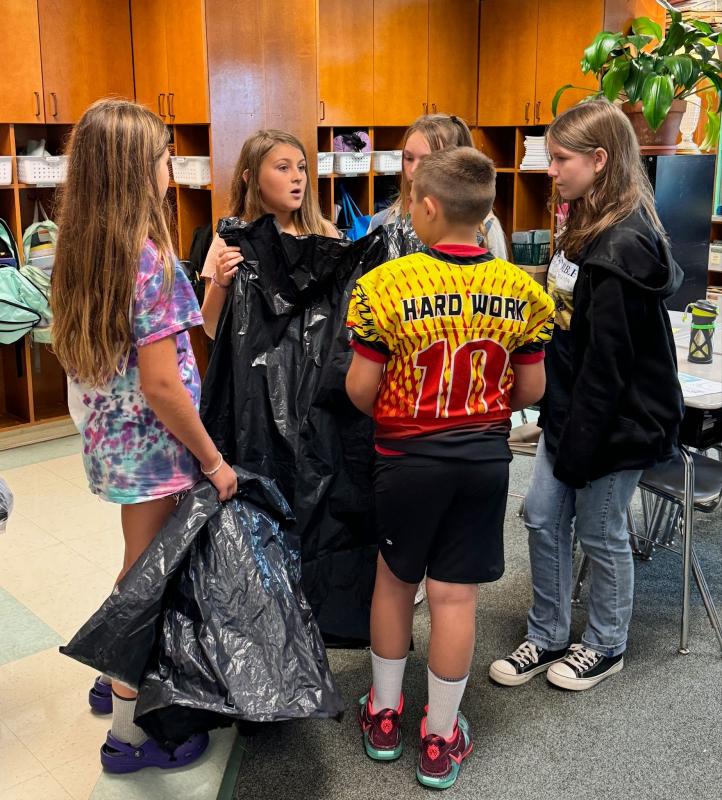 EES students discuss particular assignments on their recycled “paper route.” Hattie, daughter of Nellie Brylewski and Simon Tomko; Briar, daughter of Arianna and Brice Johnson; Azalea, daughter of Laurel and Max Averill; Bryson, son of Melissa and Joseph Hersom; and Isabel, daughter of Cashel and Brian Fanslau. Students are residents of Alna and Edgecomb. Courtesy photo EES students discuss particular assignments on their recycled “paper route.” Hattie, daughter of Nellie Brylewski and Simon Tomko; Briar, daughter of Arianna and Brice Johnson; Azalea, daughter of Laurel and Max Averill; Bryson, son of Melissa and Joseph Hersom; and Isabel, daughter of Cashel and Brian Fanslau. Students are residents of Alna and Edgecomb. Courtesy photo