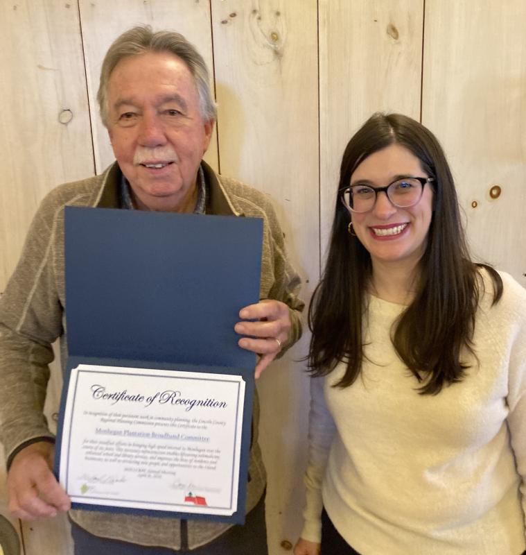 Bill Boynton, member of the Monhegan Broadband Committee and Emily Rabbe, Executive Director of LCRPC, displaying the award Monhegan's Broadband Committee received for their community planning efforts. Courtesy of LCRPC Bill Boynton, member of the Monhegan Broadband Committee and Emily Rabbe, Executive Director of LCRPC, displaying the award Monhegan's Broadband Committee received for their community planning efforts. Courtesy of LCRPC