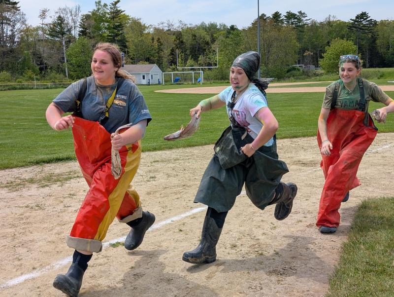 From left, Boothbay Region High School Class of 2025’s Ivory Cody, Magen Burge and Abbie Clark take part May 30 in Fishermen's Festival Field Day. CANDI JONETH/Boothbay Register 2025 Fisherman’s Festival Field Day
