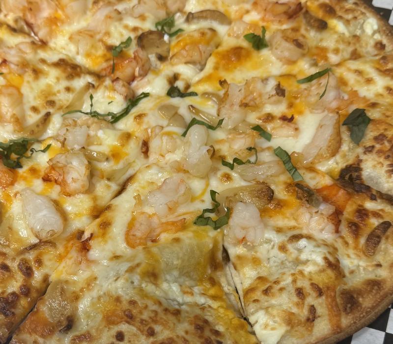 Garlic shrimp pizza at
Mine Oyster. Ralph Smith photo Garlic shrimp pizza at Mine Oyster. Ralph Smith photo