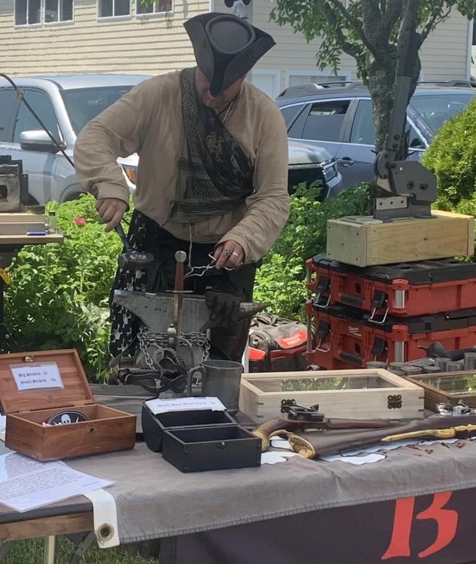 Steve Lenhardt brought his business, Black Spot Guild, to this year's Windjammer Days celebration. BILL PEARSON/Boothbay Register coin man