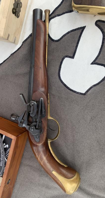 Lenhardt displays a pistol at his vendor's booth during his Friends of Windjammer Days' exhibit. BILL PEARSON/Boothbay Register pistol