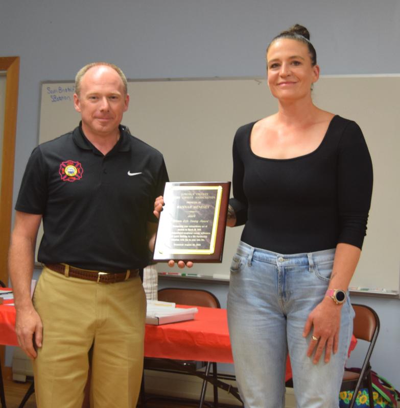 Waldoboro Fire Chief Paul Smeltzer presents Hannah Meneses with the Citizens Life Saving Award during the Lincoln County Fire Chiefs Association’s annual meeting on Wednesday, Aug. 20 in South Bristol. Meneses received the award for her actions on March 28 when she exhibited exceptional courage and quick thinking to save a man trapped in a sinking vehicle in Davis Stream in Jefferson. Christina Wallace photo Meneses