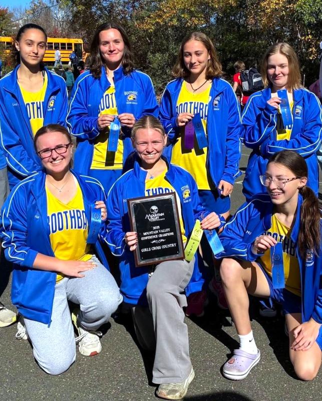 The Seahawk girls cross country team with its championship plaque. Jennifer Orchard photo Seahawk girls cross country