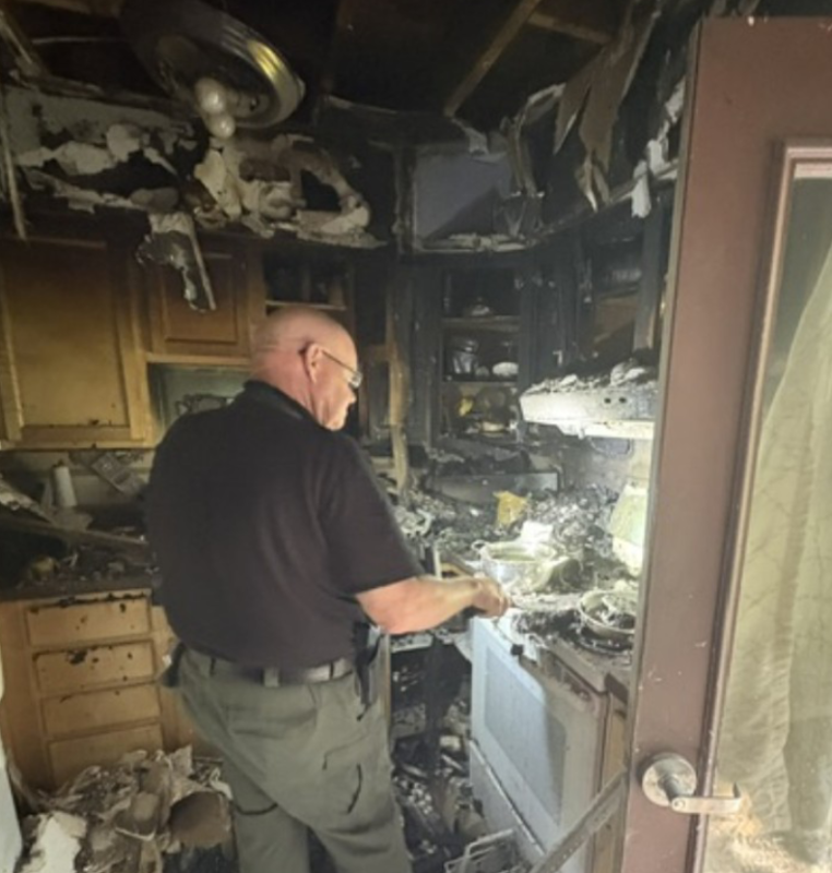 State Fire Marshal Ken MacMaster investigates the cause of a fire at the Campbell Apartments. Mark Sullivan photo