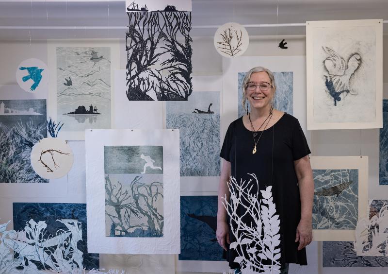 Suzanne Stokes with her installation of monoprints. Courtesy of SML