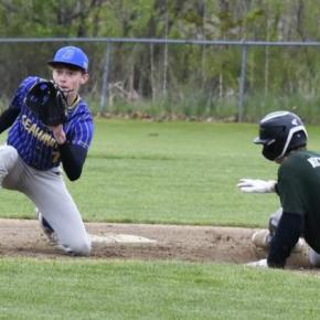 Seahawk Sam Markowitz eyes the ball as a Spruce Mountain player comes on for a slide on third base May 20. FRITZ FREUDENBERGER/Boothbay Register
