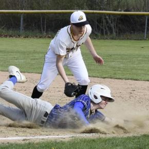 Sam Markowitz slides into first after attempting to steal against Maranacook May 13. File photo