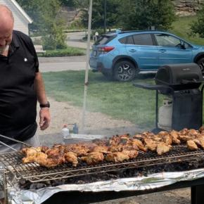 Veteran Brad Drummond tends the grill at last year's V.E.T.S. barbecue. File photo