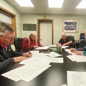 Trustees Russell Hoffman, James Stormont and Deryl Kipp approve the sewer district's budget and rates during a Dec. 4 public hearing. ISABELLE CURTIS/Boothbay Register