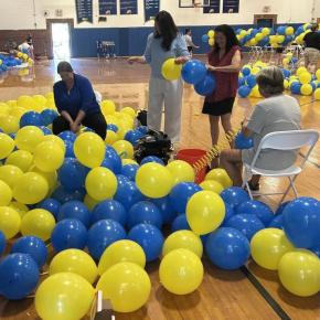 Busy as can be blowing up balloons on June 9. KEVIN BURNHAM/Boothbay Register