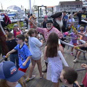 A violent clash occurred on the town pier as pirates and kids fought for control of the harbor. ISABELLE CURTIS/Boothbay Register