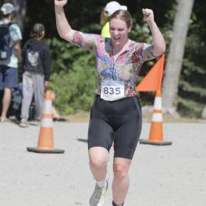 A triathlete celebrates completing the 2025 Pemaquid Beach Triathlon. Photo by Bob Kofman