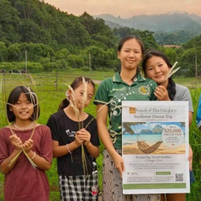 A group of the newest arrivals at the Friends of Thai Daughters residential program in Mae Chan, displaying a poster for FTD’s Sunflower Dream Trip Sweepstakes. Courtesy of Ellen James